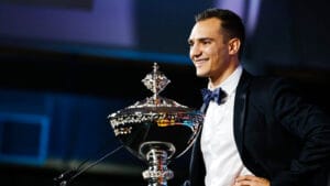 Palou on stage with the Astor Cup. Photo: IndyCar - Joe Skibinski