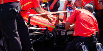 The Team Penske crew hard at work reattaching the rear wing on pit lane. Photo: Kevin Dejewski