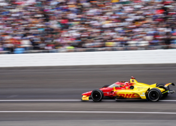 Palou flies past grandstands filled with cheering fans. Photo: Kevin Dejewski