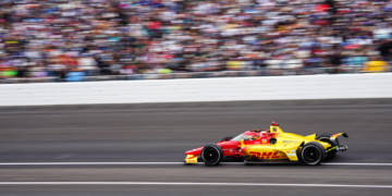 Palou flies past grandstands filled with cheering fans. Photo: Kevin Dejewski