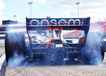 Siegel pulls away in a cloud of smoke. Photo: Kevin Dejewski