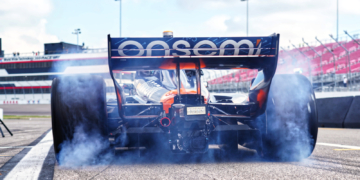 Siegel pulls away in a cloud of smoke. Photo: Kevin Dejewski