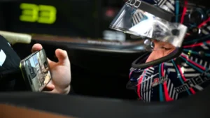 Dan Ticktum of Great Britain and CUPRA KIRO on his mobile phone while he waits in his car during practice, ahead of the Shanghai E-Prix, Round 11 of the 2025 FIA Formula E World Championship at Shanghai International Circuit on June 01, 2025 in Shanghai, China