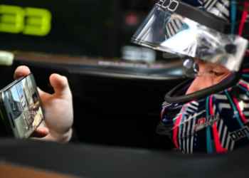 Dan Ticktum of Great Britain and CUPRA KIRO on his mobile phone while he waits in his car during practice, ahead of the Shanghai E-Prix, Round 11 of the 2025 FIA Formula E World Championship at Shanghai International Circuit on June 01, 2025 in Shanghai, China
