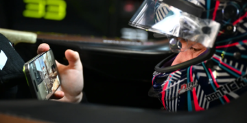 Dan Ticktum of Great Britain and CUPRA KIRO on his mobile phone while he waits in his car during practice, ahead of the Shanghai E-Prix, Round 11 of the 2025 FIA Formula E World Championship at Shanghai International Circuit on June 01, 2025 in Shanghai, China