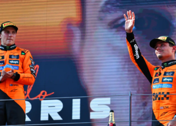 Lando Norris and Oscar Piastri [McLaren] celebrate their 1-2 finish at the 2025 F1 Austrian GP