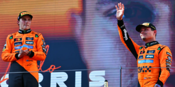 Lando Norris and Oscar Piastri [McLaren] celebrate their 1-2 finish at the 2025 F1 Austrian GP