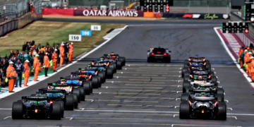 Nico Hulkenberg (GER) Sauber C45 and Oliver Bearman (GBR) Haas VF-25 at the back of the grid before the start of the race. 06.07.2025. Formula 1 World Championship, Rd 12, British Grand Prix, Silverstone, England, Race Day