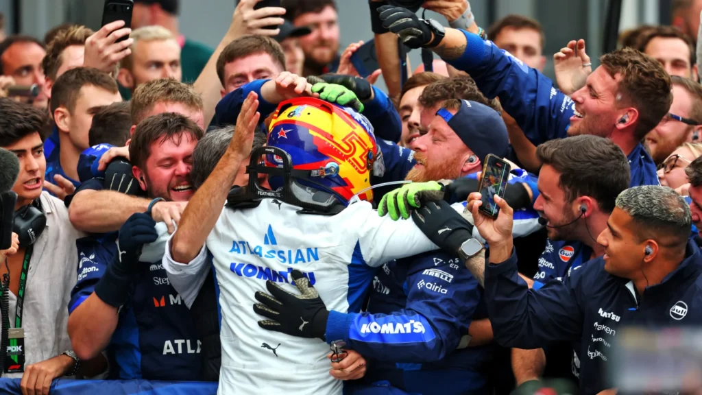 Spot the lucky mascot on Carlos Sainz's helmet