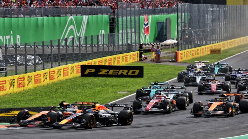 Max Verstappen took to the run off at Turn 1 as Lando Norris dived down the inside
