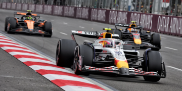 Lando Norris [back] struggled to match the pace of Yuki Tsunoda [middle] in the Azerbaijan GP