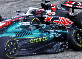 Stroll and Ocon make contact at Turn 1 during the Sprint at the US Grand Prix, debris scattering as both cars slide wide into the runoff area.