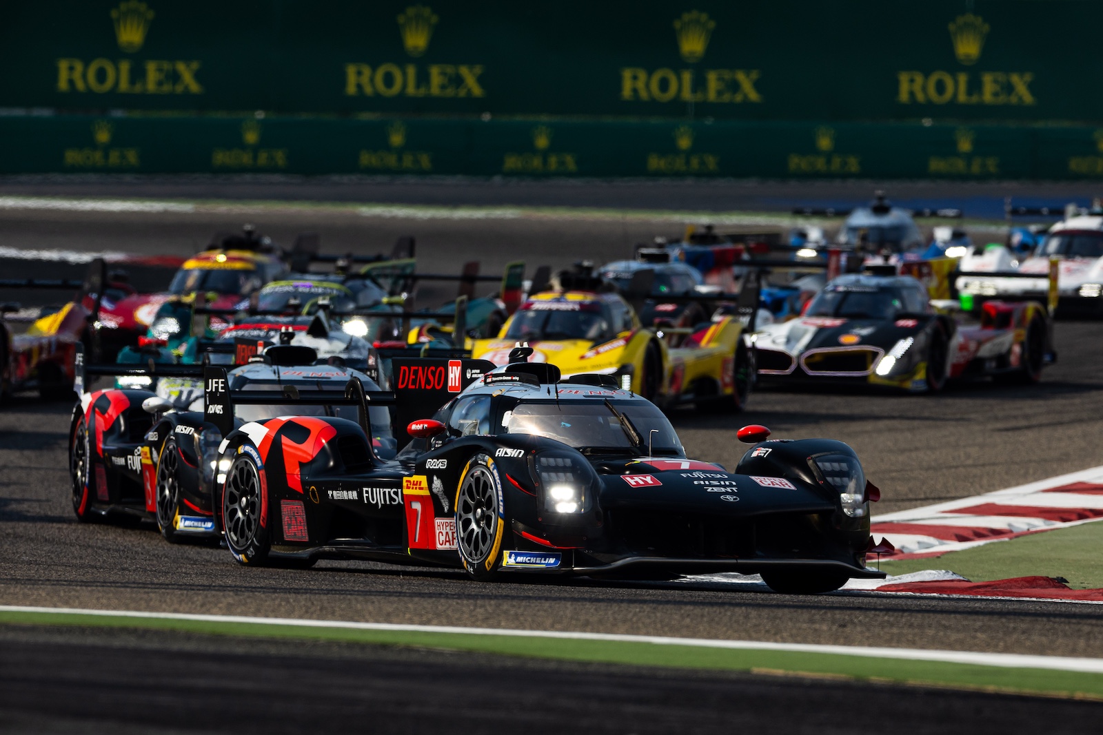 Toyota’s Nyck de Vries leads from #51 Ferrari a quarter in at Bahrain