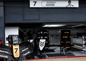 The fictional APXGP team garage during filming of F1: The Movie