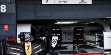 The fictional APXGP team garage during filming of F1: The Movie