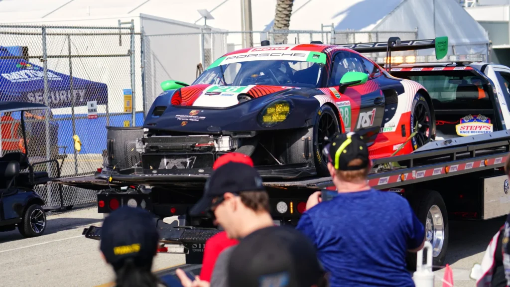 The #28 Rs1 Porsche is towed back after an early shunt. Image: Kevin Dejewski