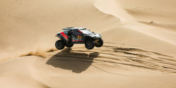 Nasser on a charge with one hand on the trophy