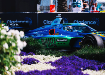 Rosenqvist streaks past flowers on his way to pole. Photo: IndyCar - Joe Skibinski
