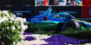 Rosenqvist streaks past flowers on his way to pole. Photo: IndyCar - Joe Skibinski