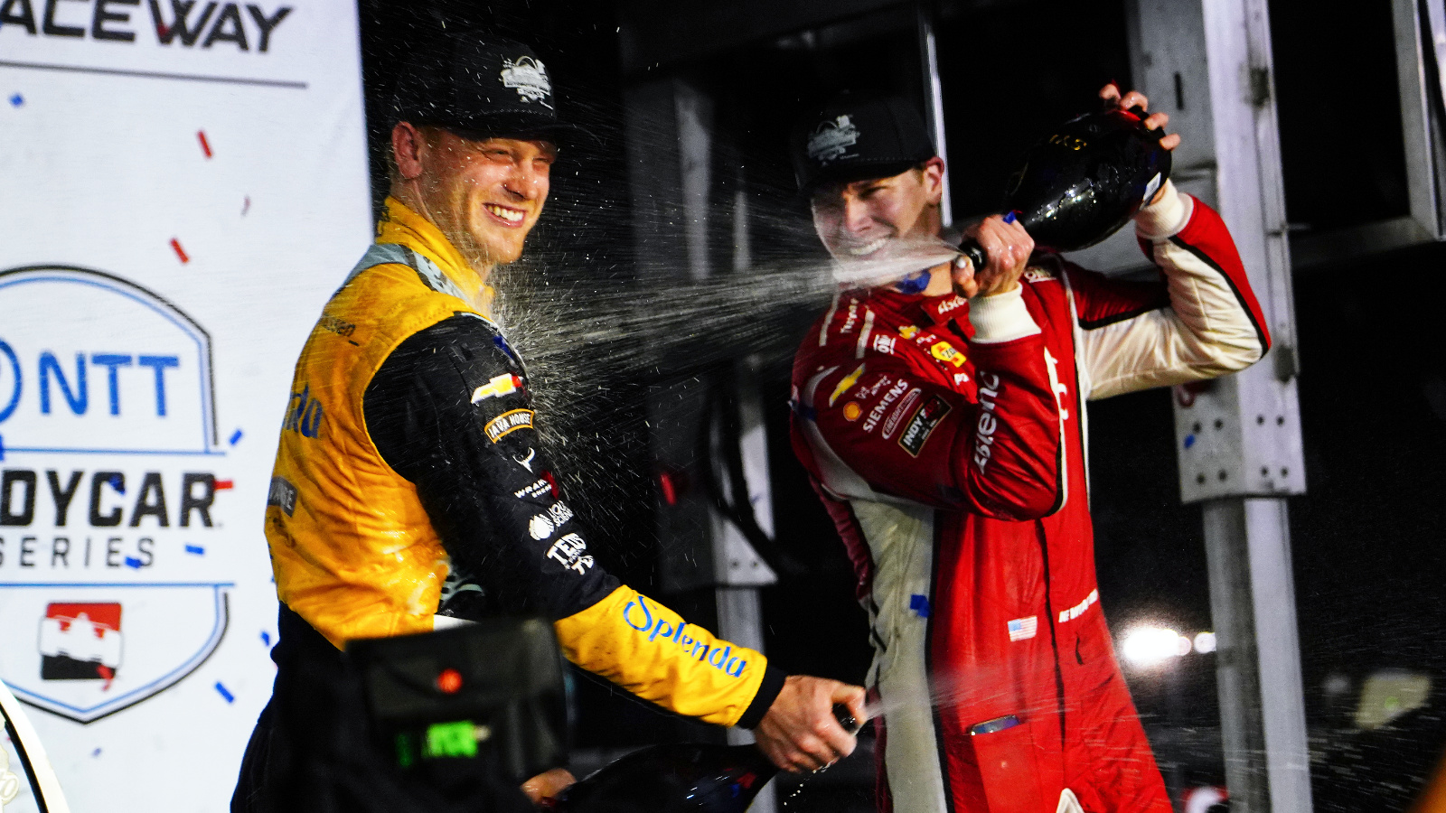 Newgarden and Rasmussen celebrate together on the podium. Photo: Kevin Dejewski