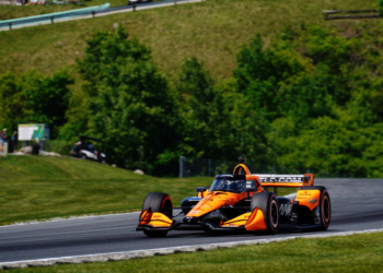 O'Ward speeds through the final turn with hills in the background. Photo: Kevin Dejewski