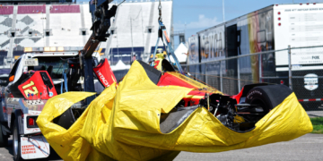 Malukas' car was brought back to the paddock with a cloth underneath to contain fluids. Photo: Kevin Dejewski