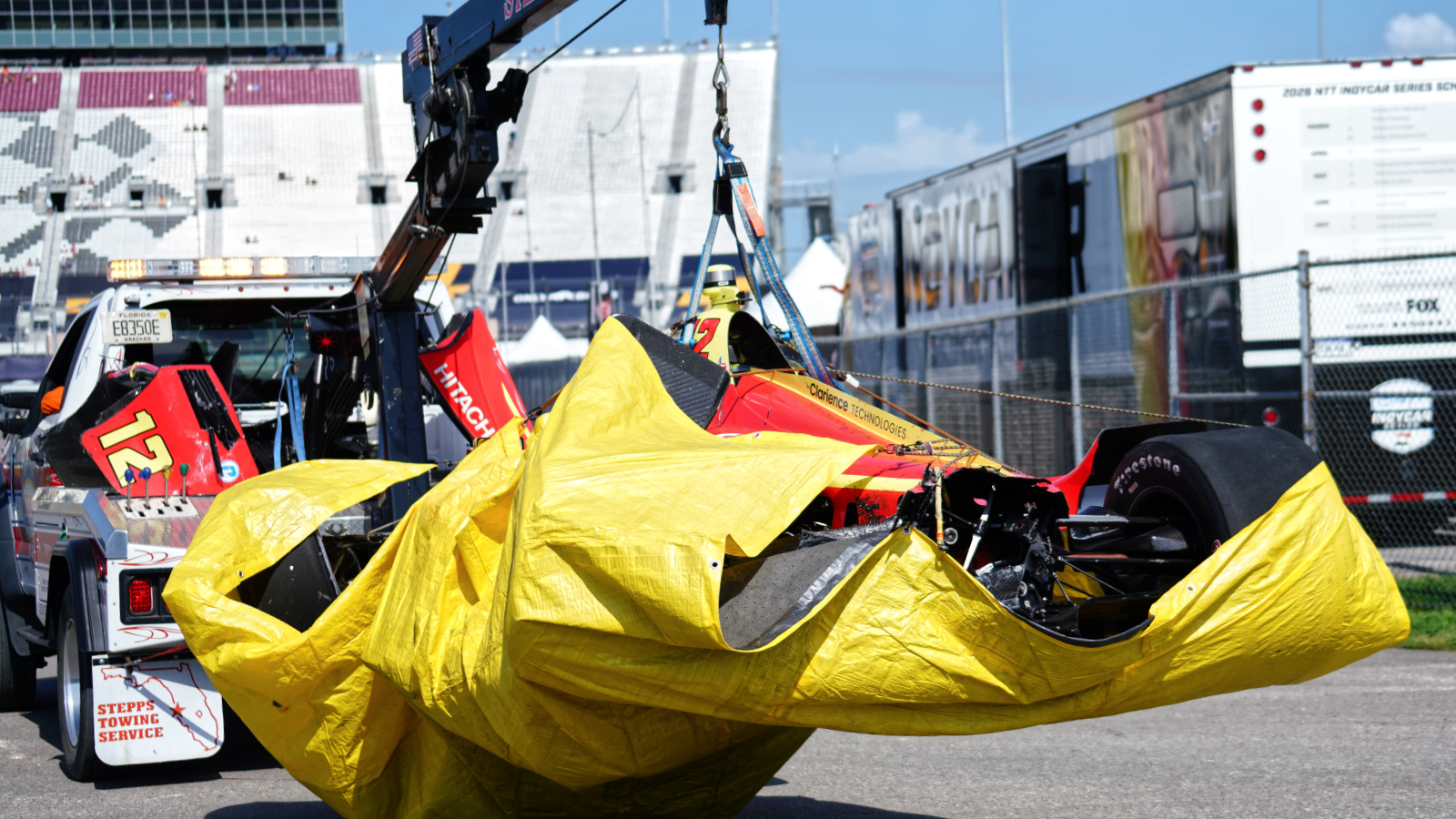Malukas' car was brought back to the paddock with a cloth underneath to contain fluids. Photo: Kevin Dejewski