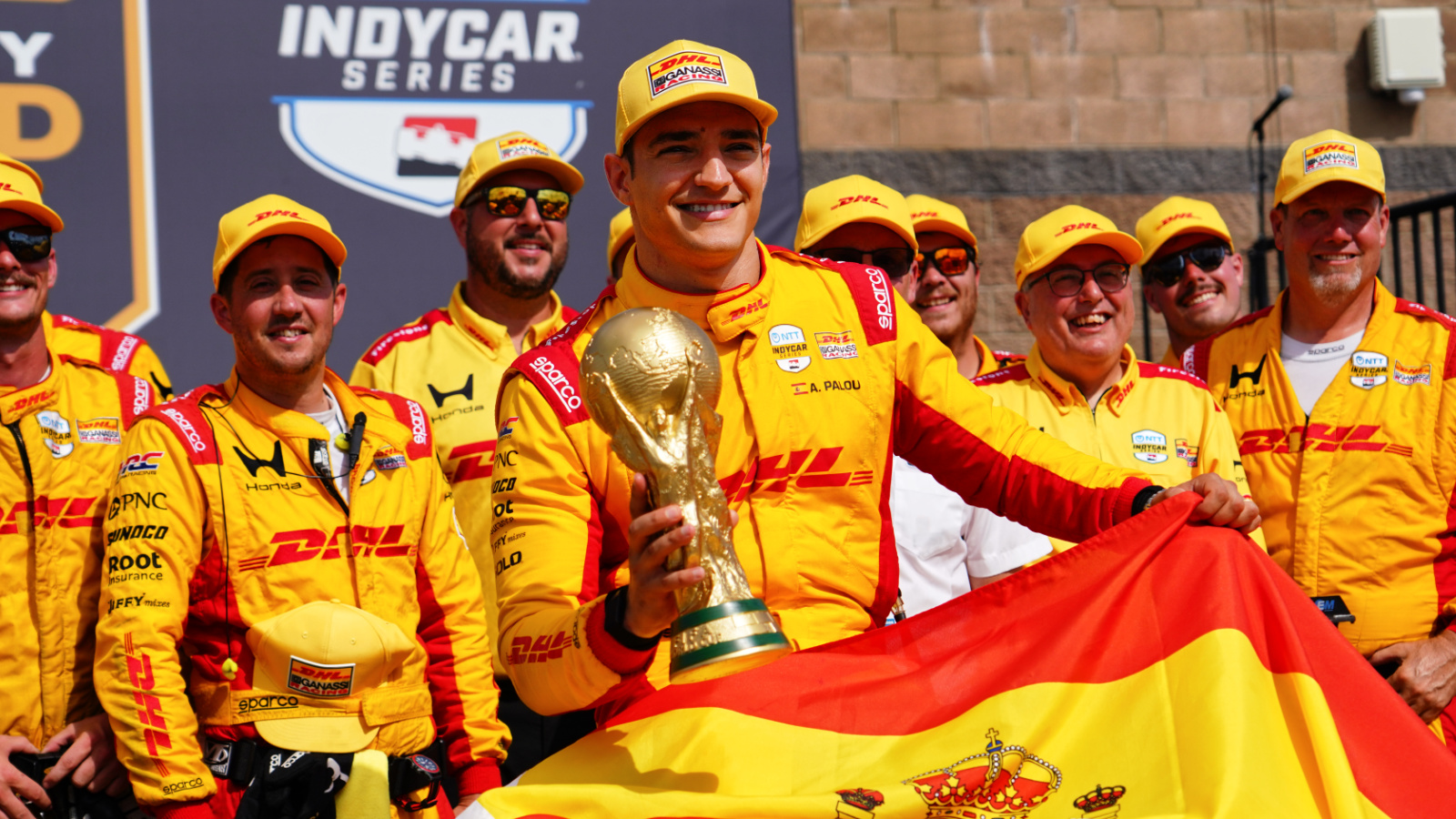 Palou celebrates with a replica World Cup trophy in victory lane. Photo: Kevin Dejewski