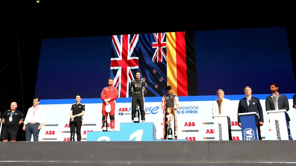 BERLIN, GERMANY - MAY 03: Race winner Mitch Evans of New Zealand and Jaguar TCS Racing, Second placed Oliver Rowland of Great Britain and Nissan Formula E Team, and Third placed Pascal Wehrlein of Germany and Porsche Formula E Team, on the podium during the Berlin E-Prix, Round 8 of the 2026 FIA Formula E World Championship at Tempelhof Airport Circuit on May 03, 2026 in Berlin, Germany. (Photo by Simon Galloway/LAT Images)