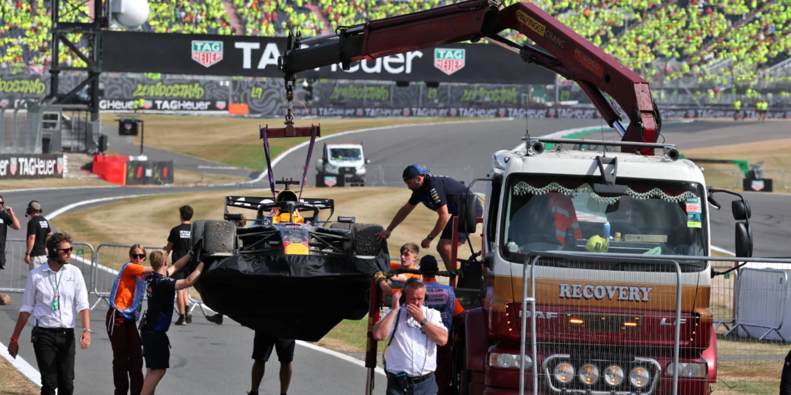 The wreckage of Max Verstappen's Red Bull was towed away after the British GP
