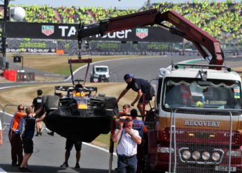 The wreckage of Max Verstappen's Red Bull was towed away after the British GP