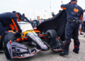 Andretti crew covers Will Power's car on the grid as rain moved in. Photo: Kevin Dejewski