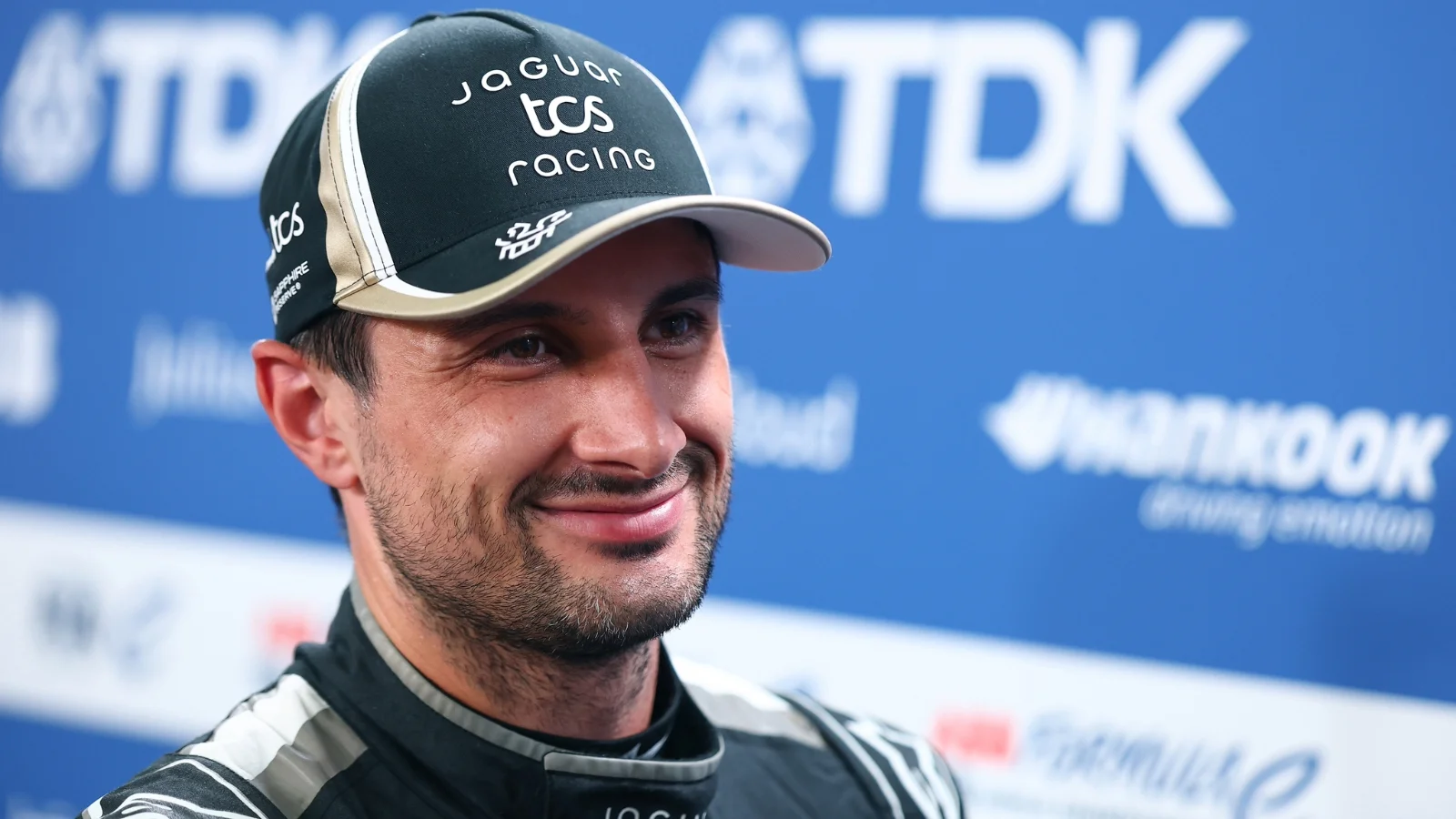 TOKYO, JAPAN - JULY 26: Mitch Evans of New Zealand and Jaguar TCS Racing talks to the media during qualifying, ahead of the Tokyo E-Prix, Round 15 of the 2026 FIA Formula E World Championship at Tokyo Street Circuit on July 26, 2026 in Tokyo, Japan.