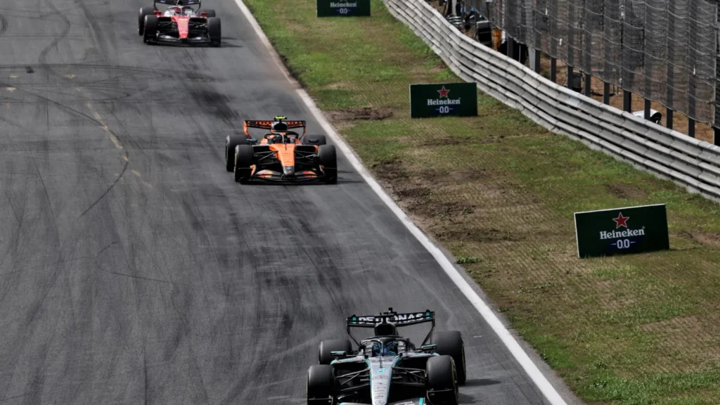 Russell fended off Norris and Leclerc to the chequered flag