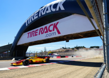 Racing under the iconic bridge at Turn 3. Photo: Kevin Dejewski