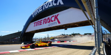 Racing under the iconic bridge at Turn 3. Photo: Kevin Dejewski