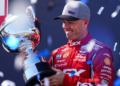 McLaughlin lifts the final race trophy of the season. Photo: Kevin Dejewski