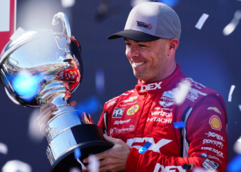 McLaughlin lifts the final race trophy of the season. Photo: Kevin Dejewski