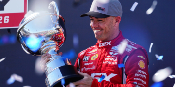 McLaughlin lifts the final race trophy of the season. Photo: Kevin Dejewski