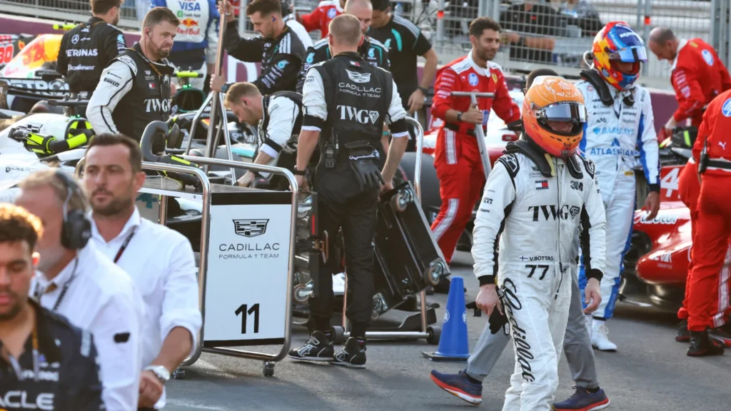 Valtteri Bottas walks back to parc ferme after crashing out with just two laps to go