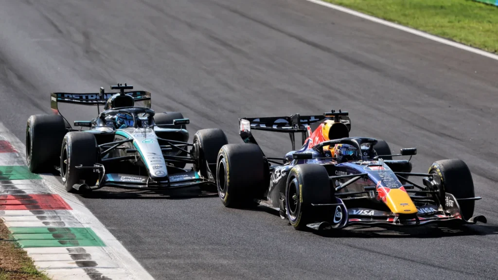 Max Verstappen and George Russell on track at the Italian GP