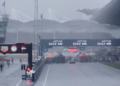 The race start at Sepang has been delayed due to heavy rain